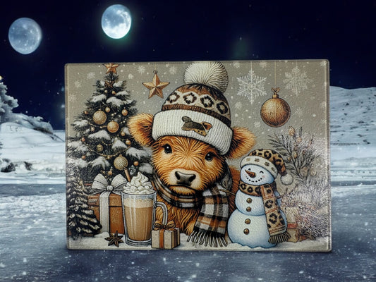 highland cow and snowman glass cutting board